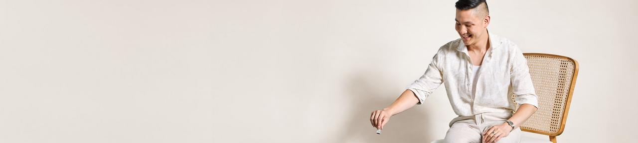 Male model wearing a white causal shirt playing chess