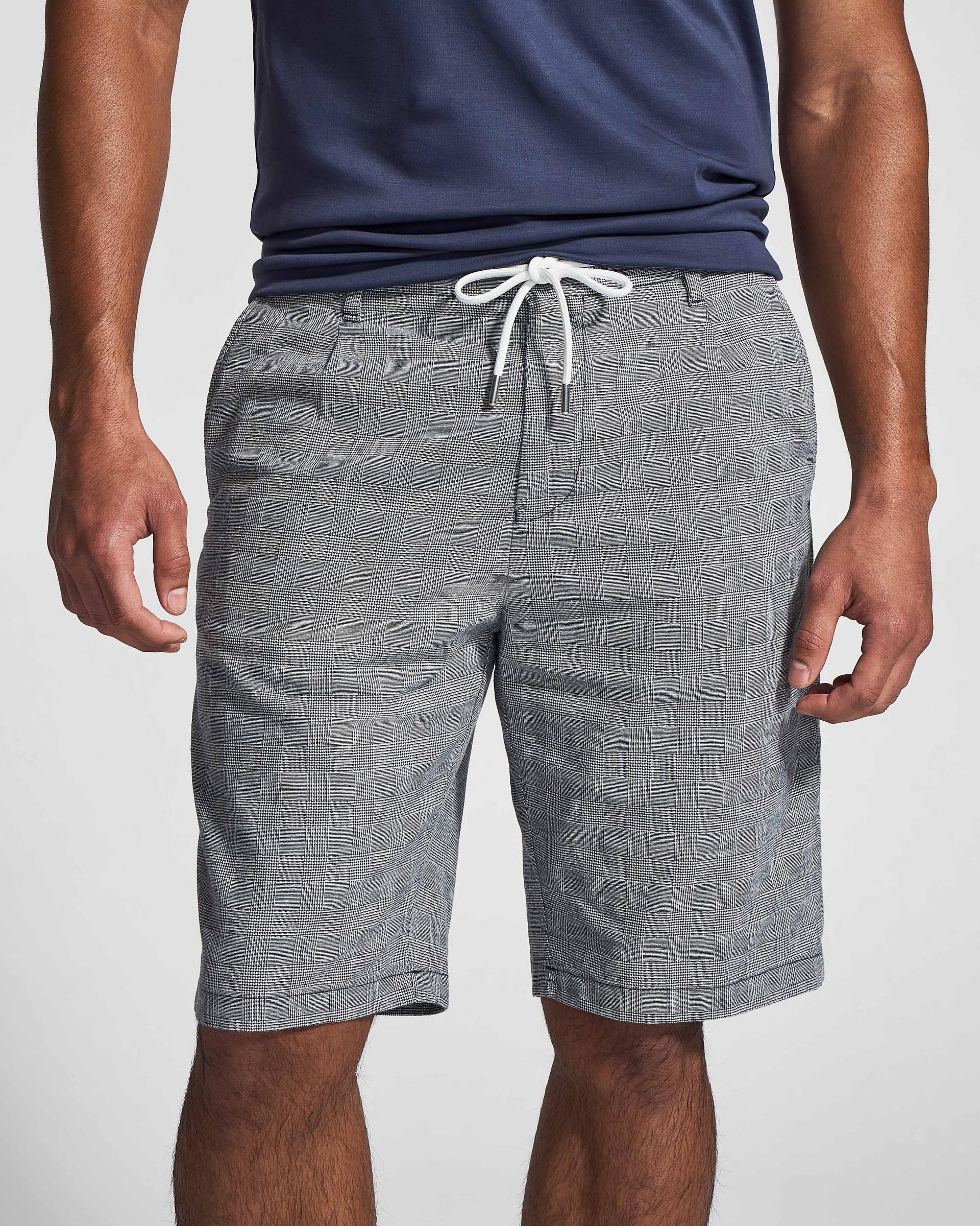 Male model wearing grey shorts at FinalCut by Harry Rosen