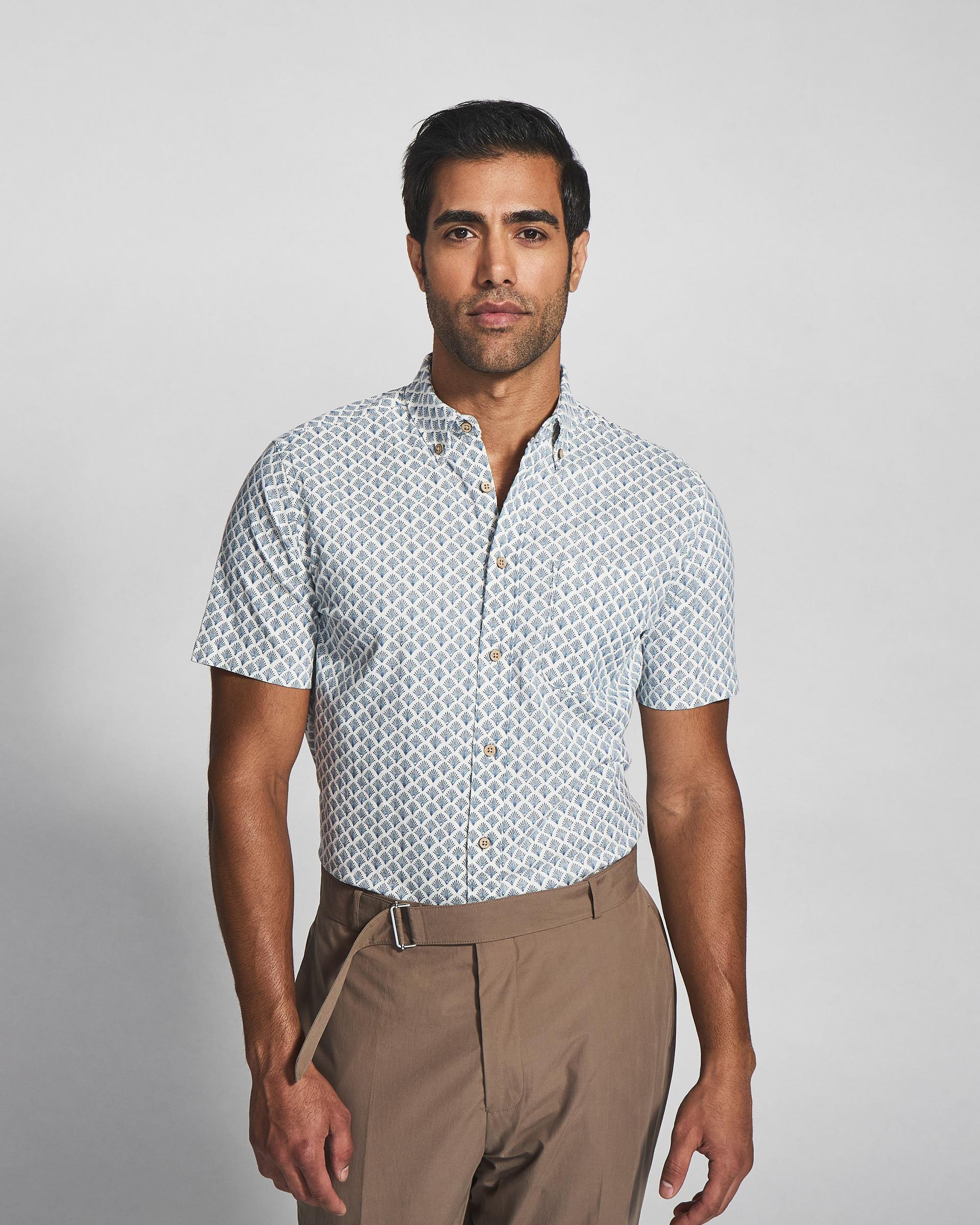 Male model wearing patterned casual shirt signifying up to 70% off casual shirts