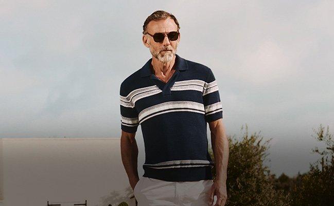 Male model wearing Zegna blue and white polo