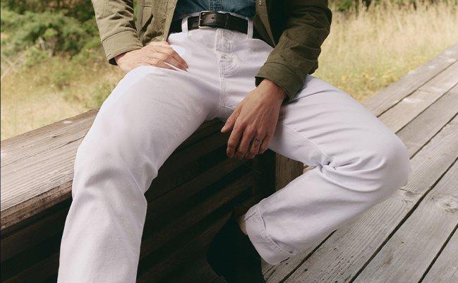 Male model wearing white jeans