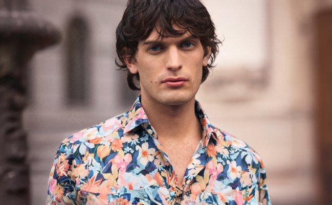 A man wearing a floral print shirt