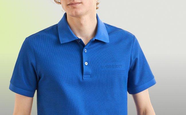  A man wearing a bright blue short-sleeve polo shirt with a small, embroidered Burberry logo on the chest