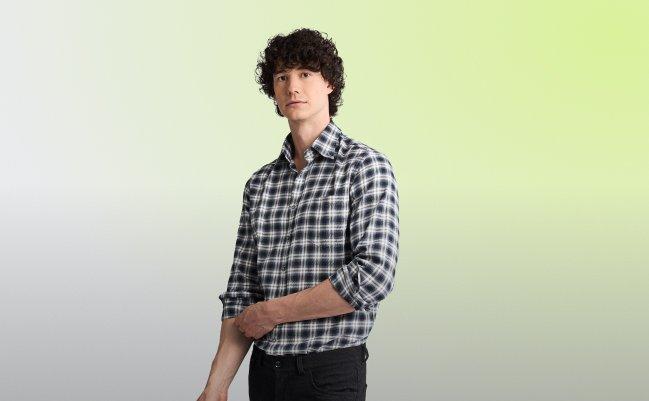 Model wearing a white and black checked casual shirt