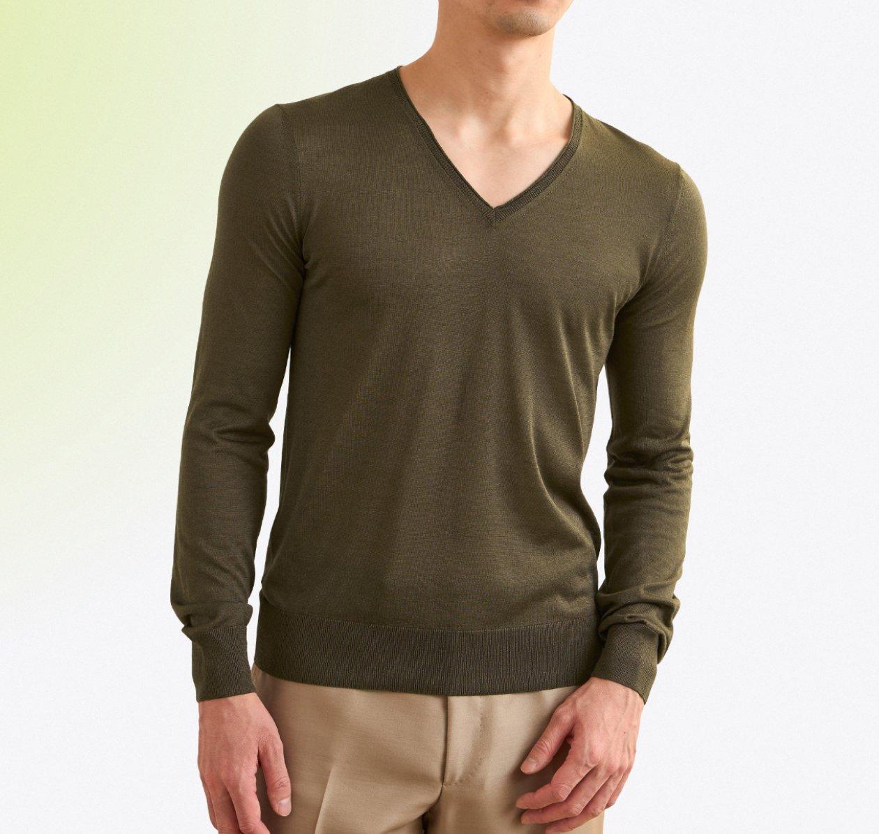 Male model wearing a luxury olive green sweater