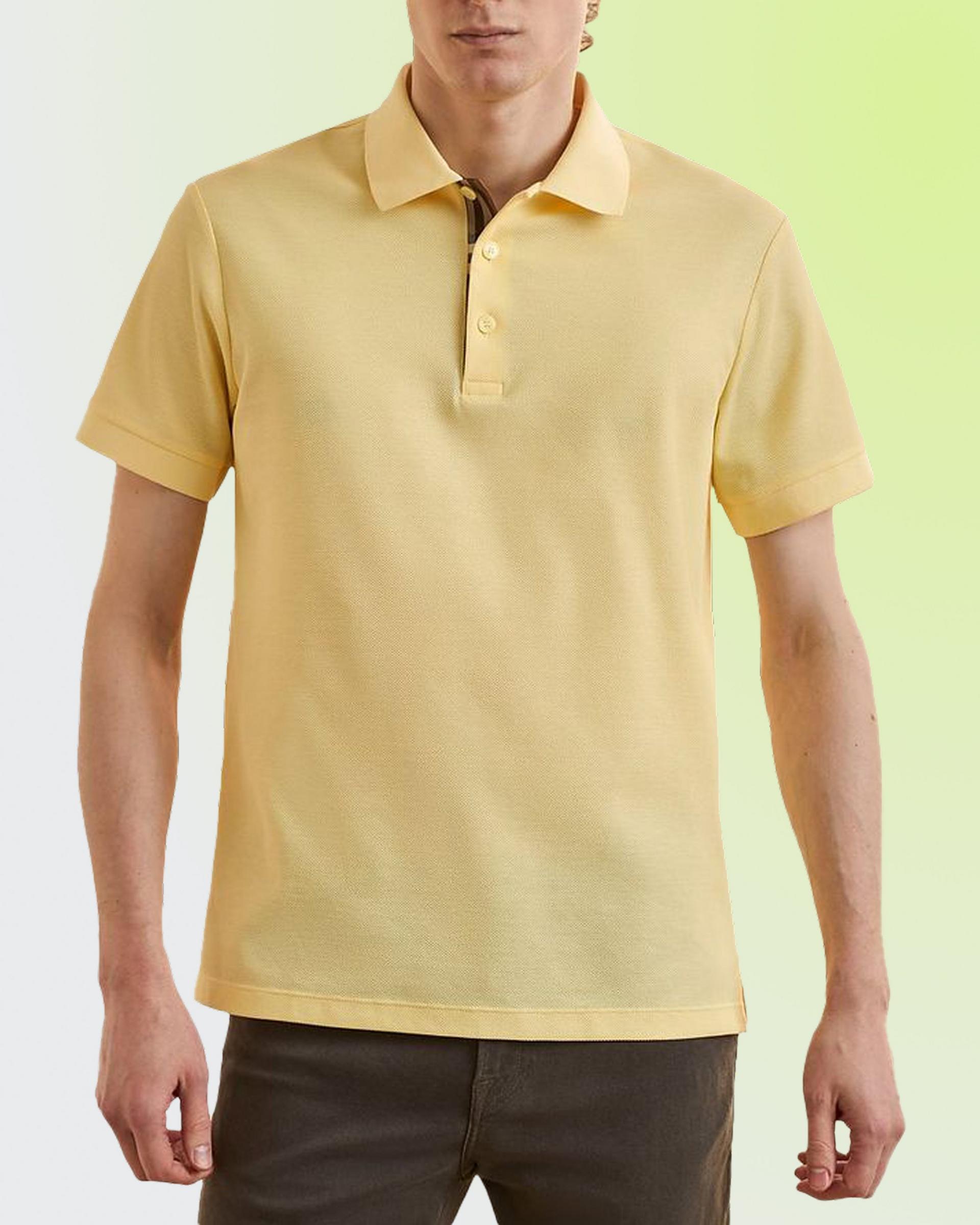 Model wearing a yellow polo shirt 