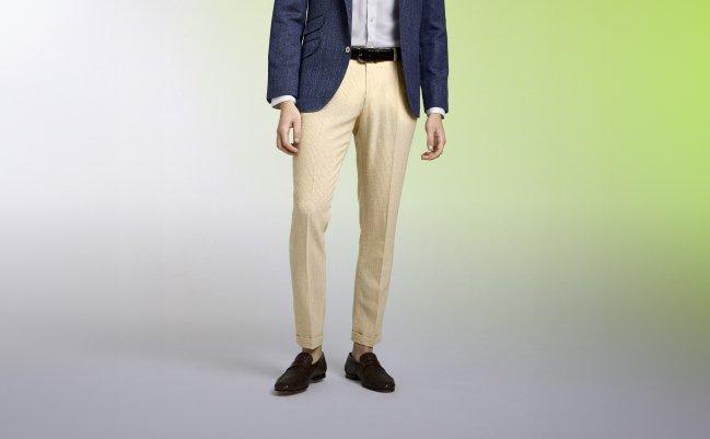 model wear beige pants and a navy sports jacket