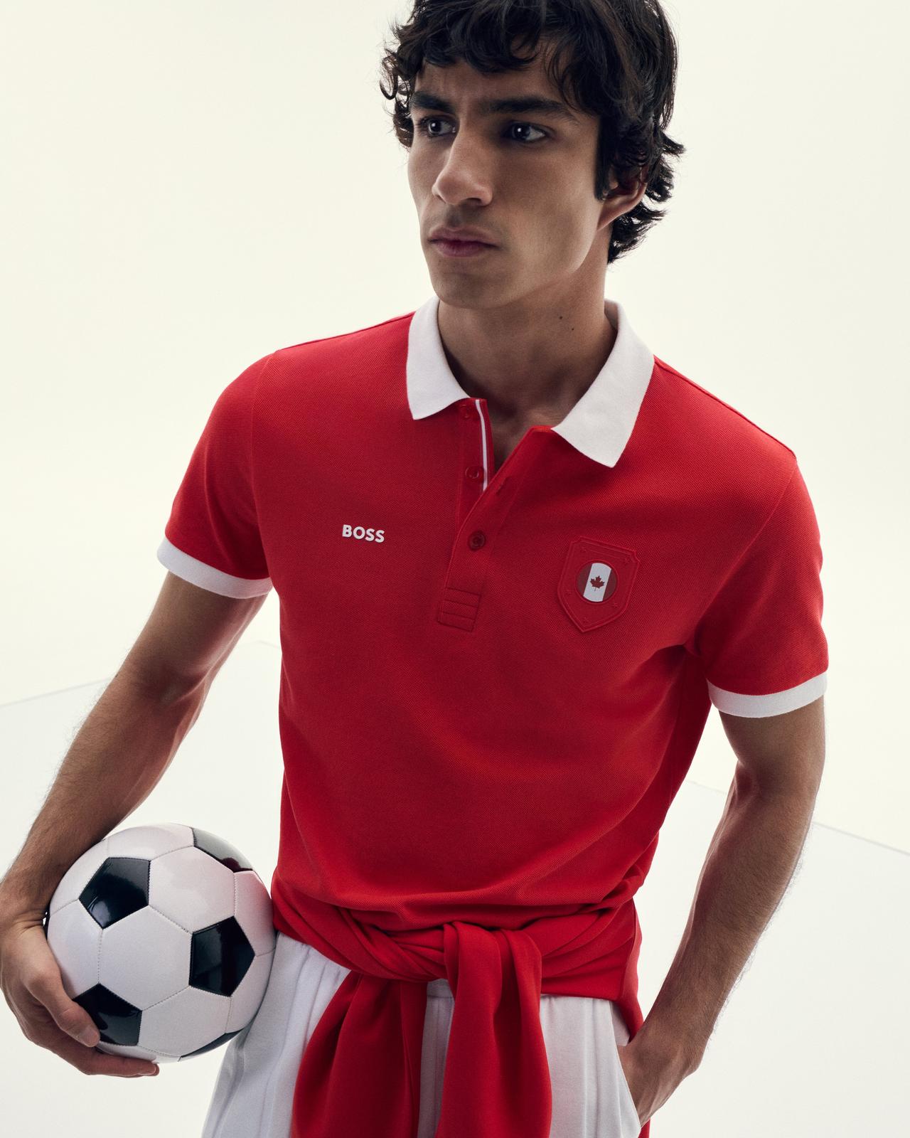 A man wearing a BOSS red and white polo t-shirt with Canada flag showing on right side