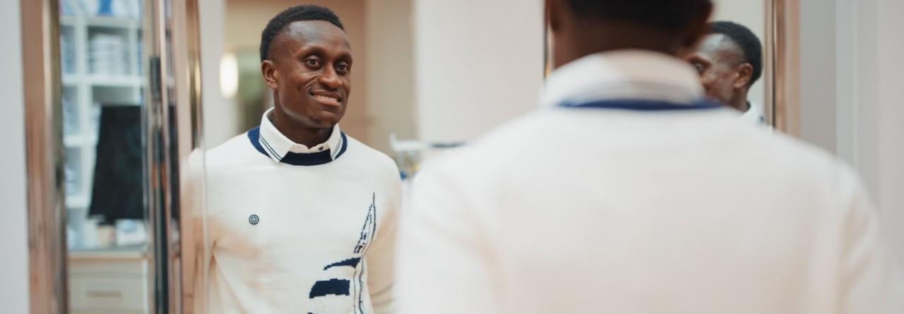 Richie Lareya wearing an off-white sweater
