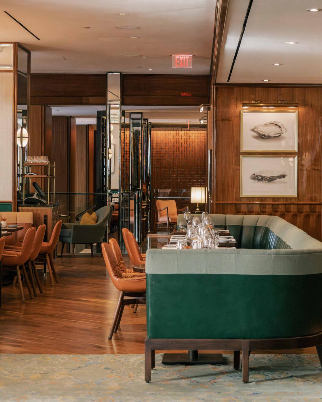 Four Seasons Hotel Toronto, featuring plush seating, warm wood paneling, and a sophisticated open-plan layout