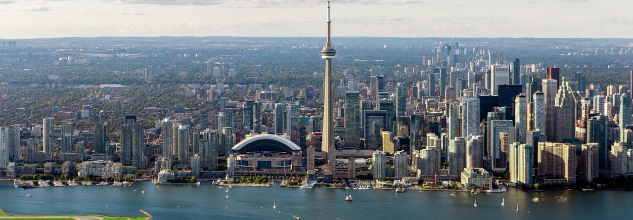 Toronto Skyline, with the iconic CN Tower rising above the city's dense cluster of modern high-rises