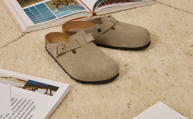 A man wearing black sandals