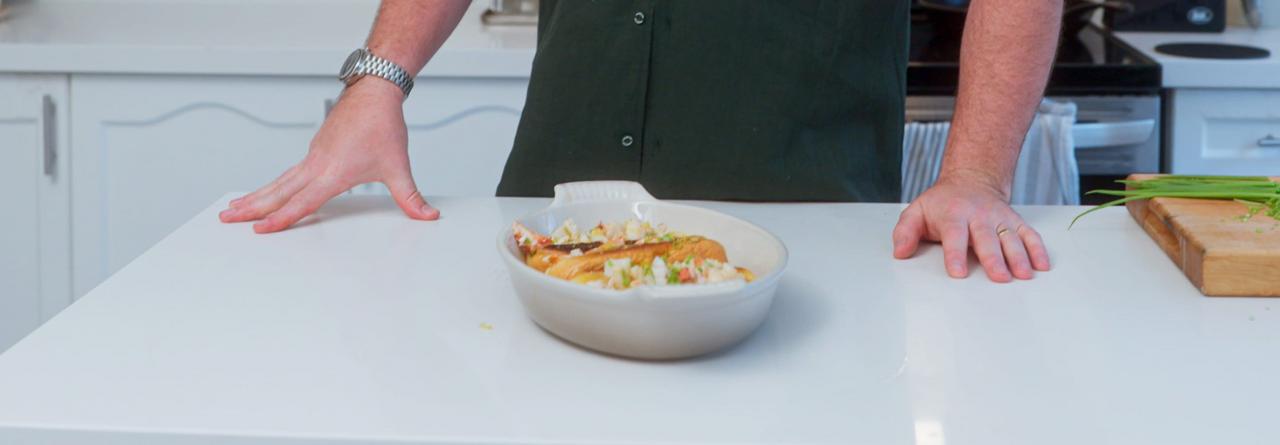 Coulson Armstrong presents lobster rolls on a white oval platter