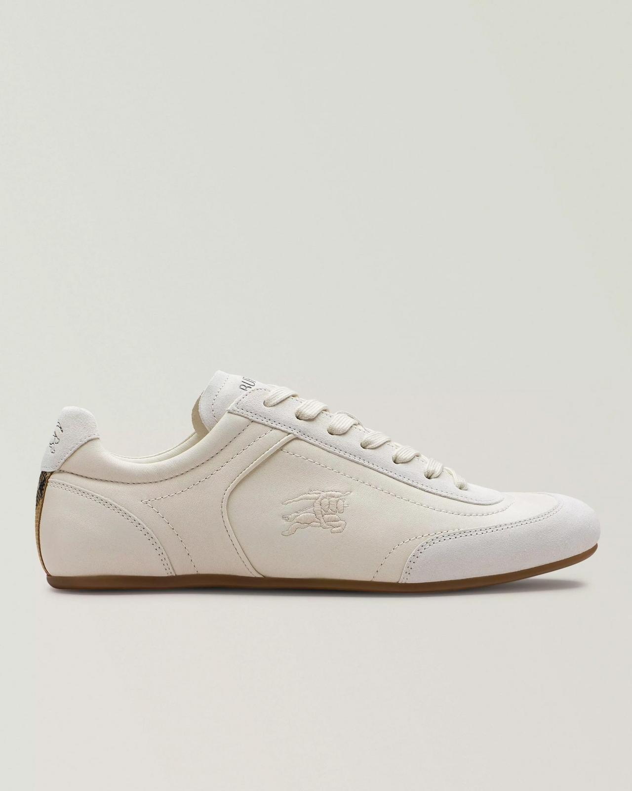 An off-white colorway with a minimalist design and subtle embossed logo