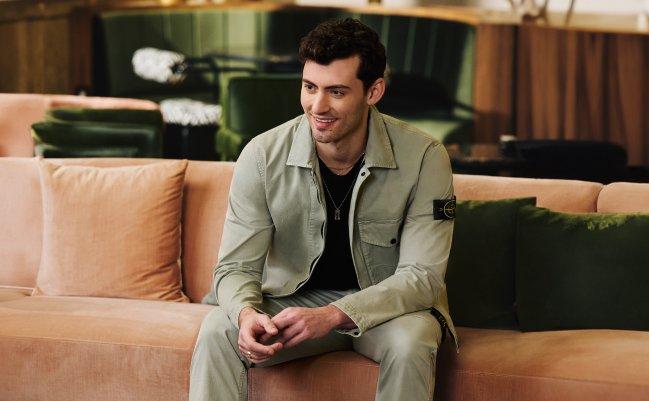 A man wearing a khaki overshirt and matching pants