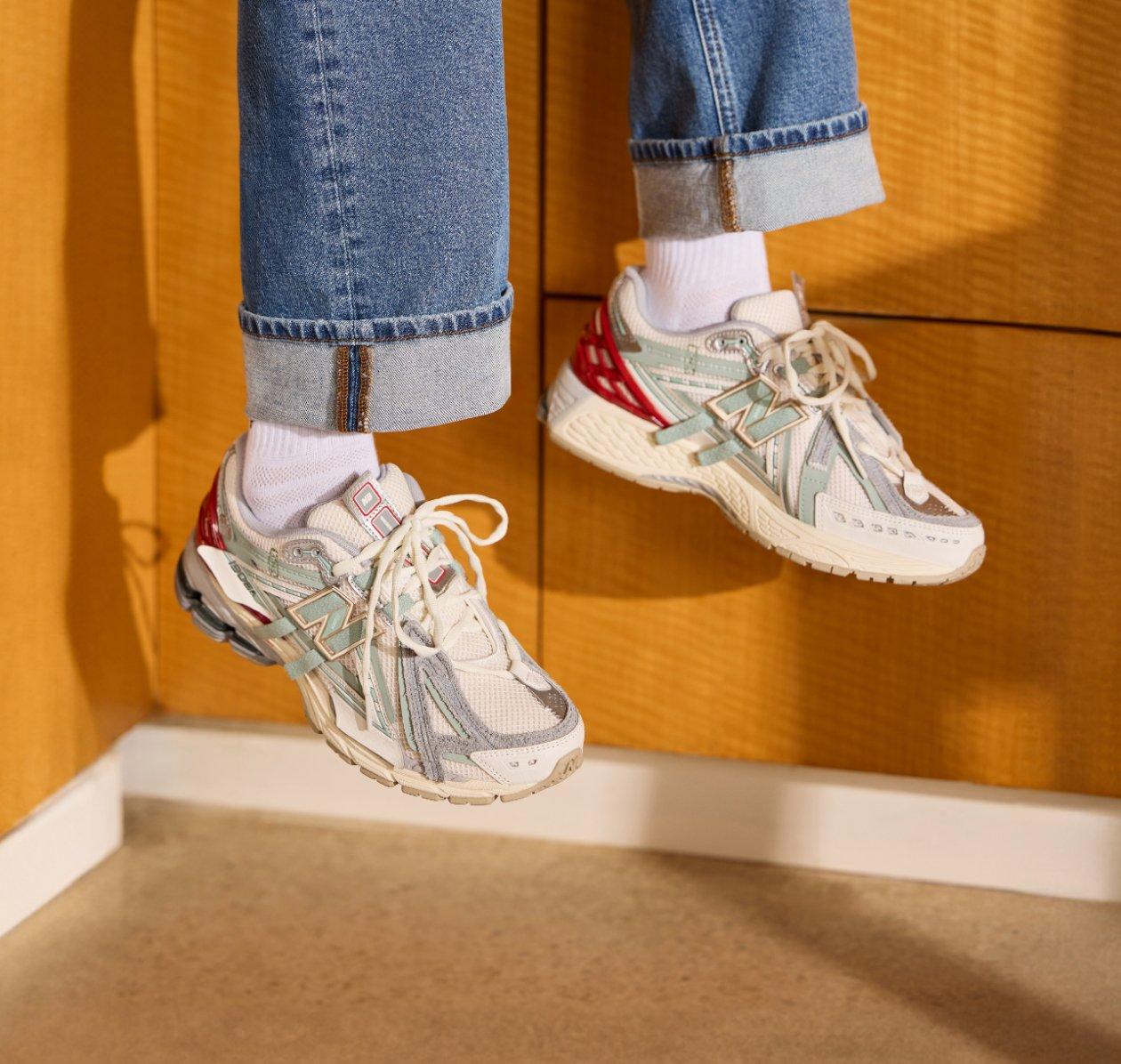 A man wearing a beige and light green sneakers