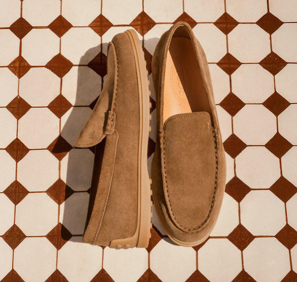 A light brown loafer on the floor
