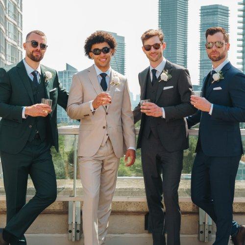 four men in coordinated wedding attire