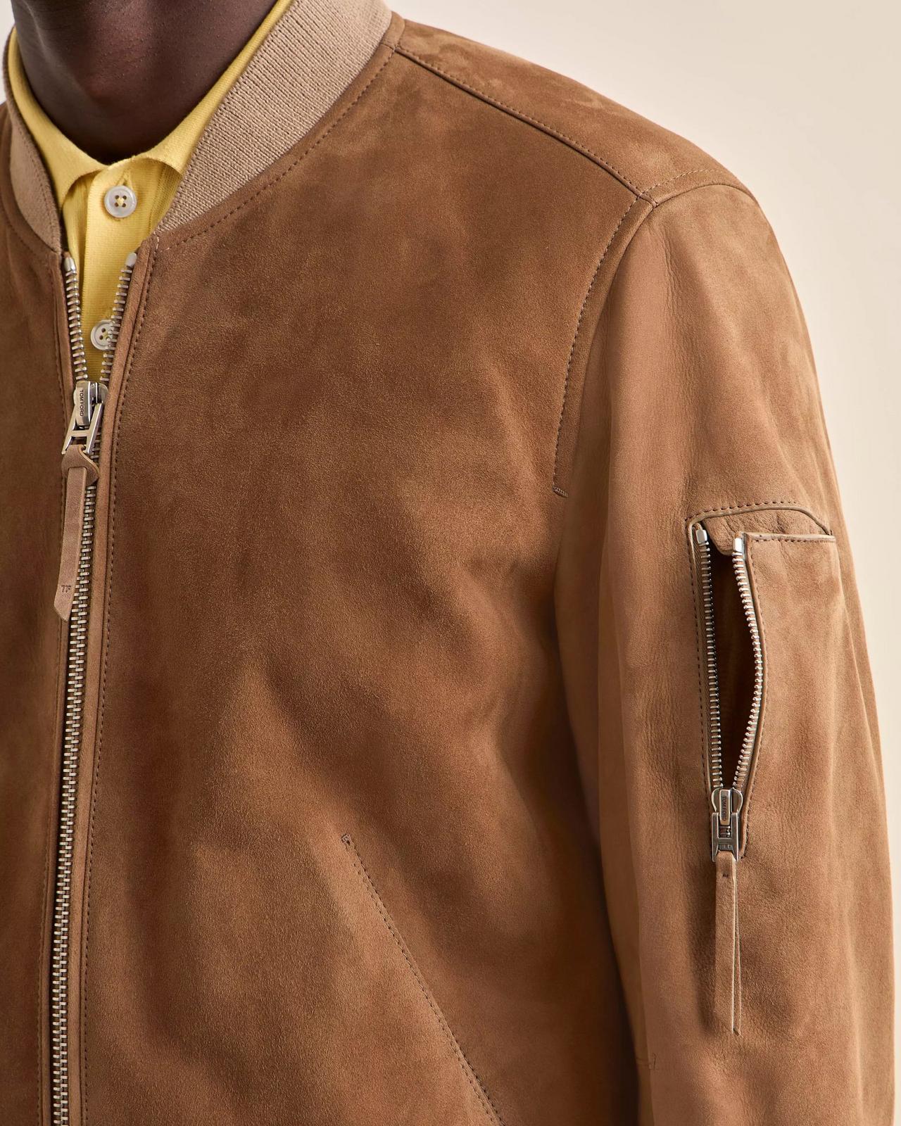 A man wearing a light brown Suede Jacket