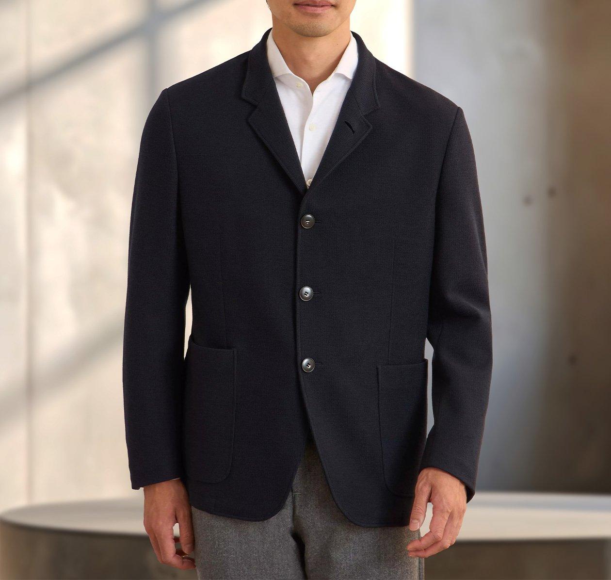 Male model wearing black Canali cardigan