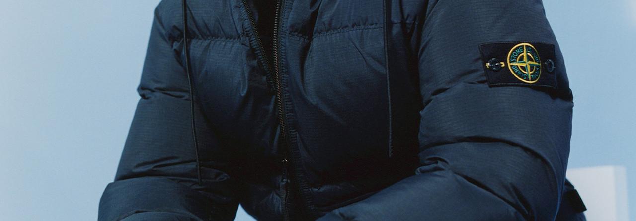 A model wearing a Stone Island cold-weather jacket