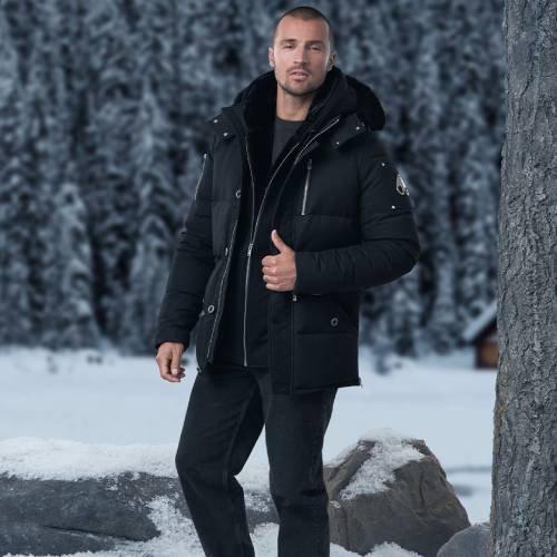 Male model wearing Moose Knuckles coat symbolizing whats the ideal winter coat length?