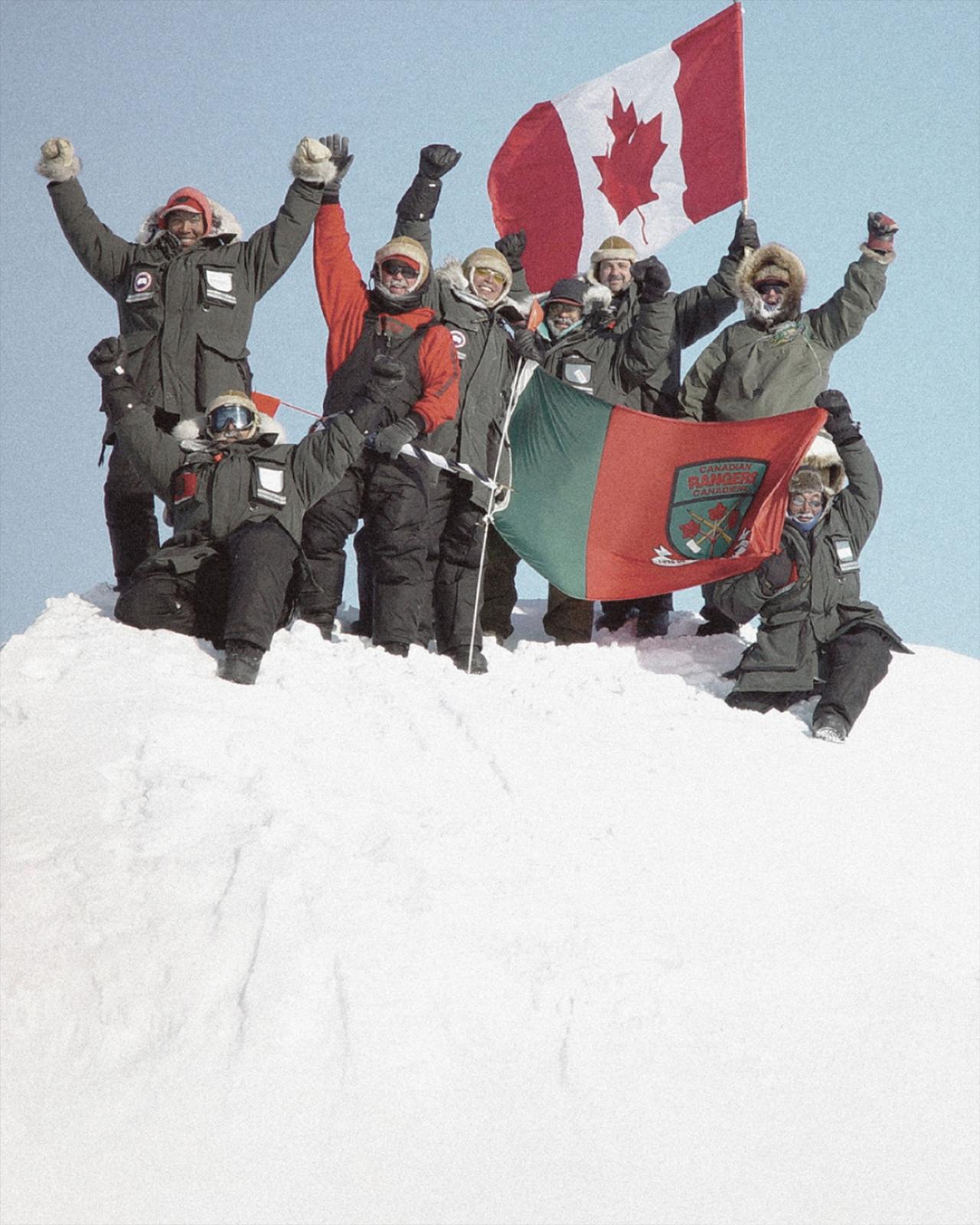 group of people wearing Canada Goose