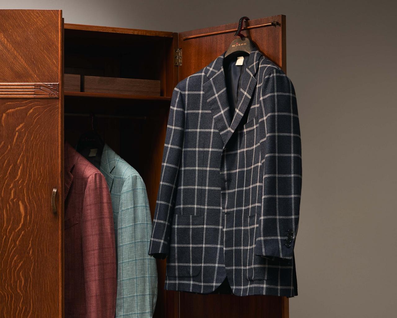 Kiton sport jackets hanging in closet illustrating a look inside Harry's closet