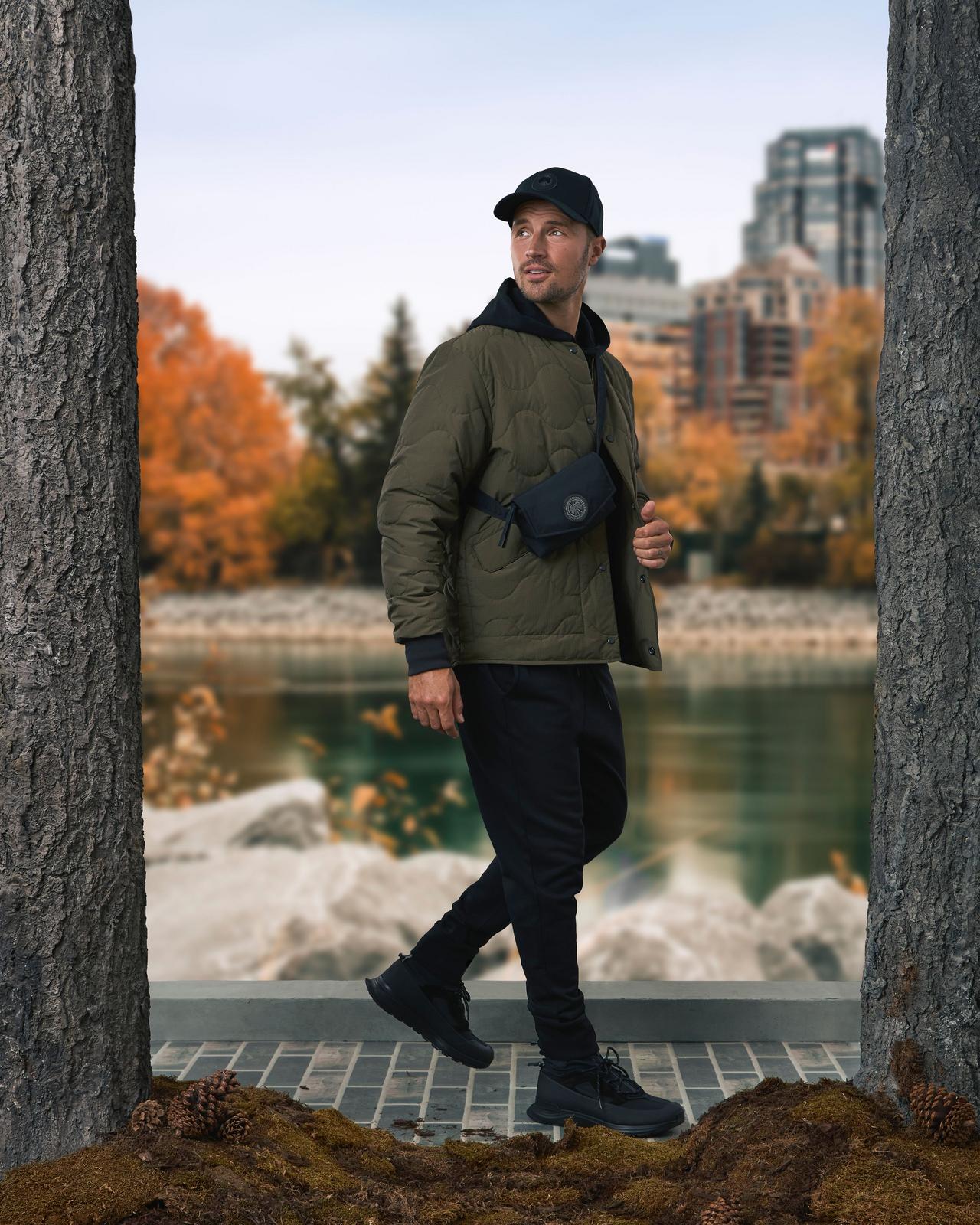 Male model wearing Canada Goose jacket illustrating the Chore Jacket