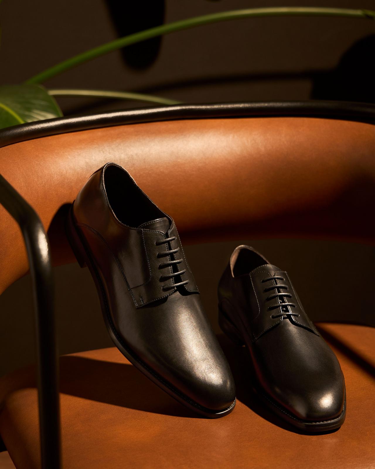 Pair of dress shoes displayed illustrating timeless staples