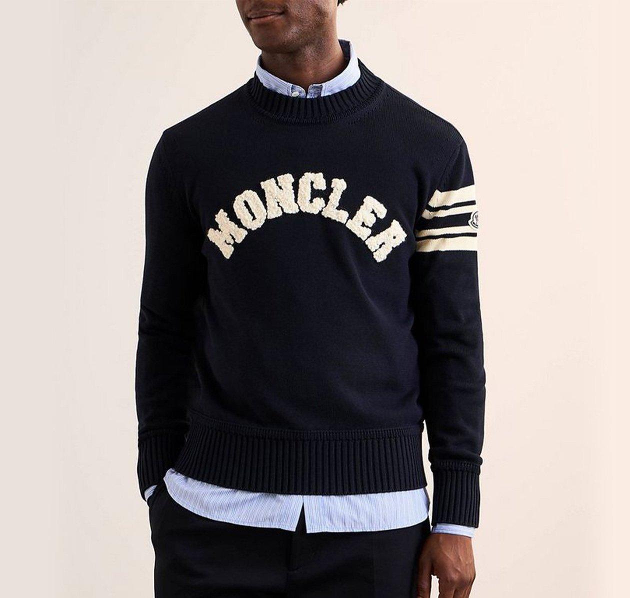 Male model wearing a grey Brunello Cucinelli sweater