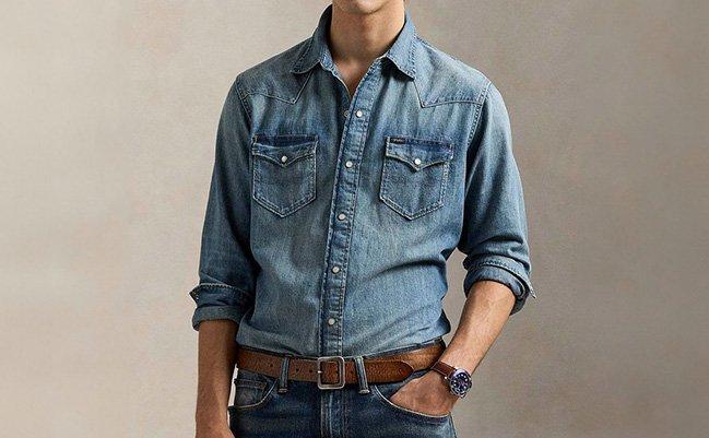 A man wearing a blue denim shirt paired with blue jeans