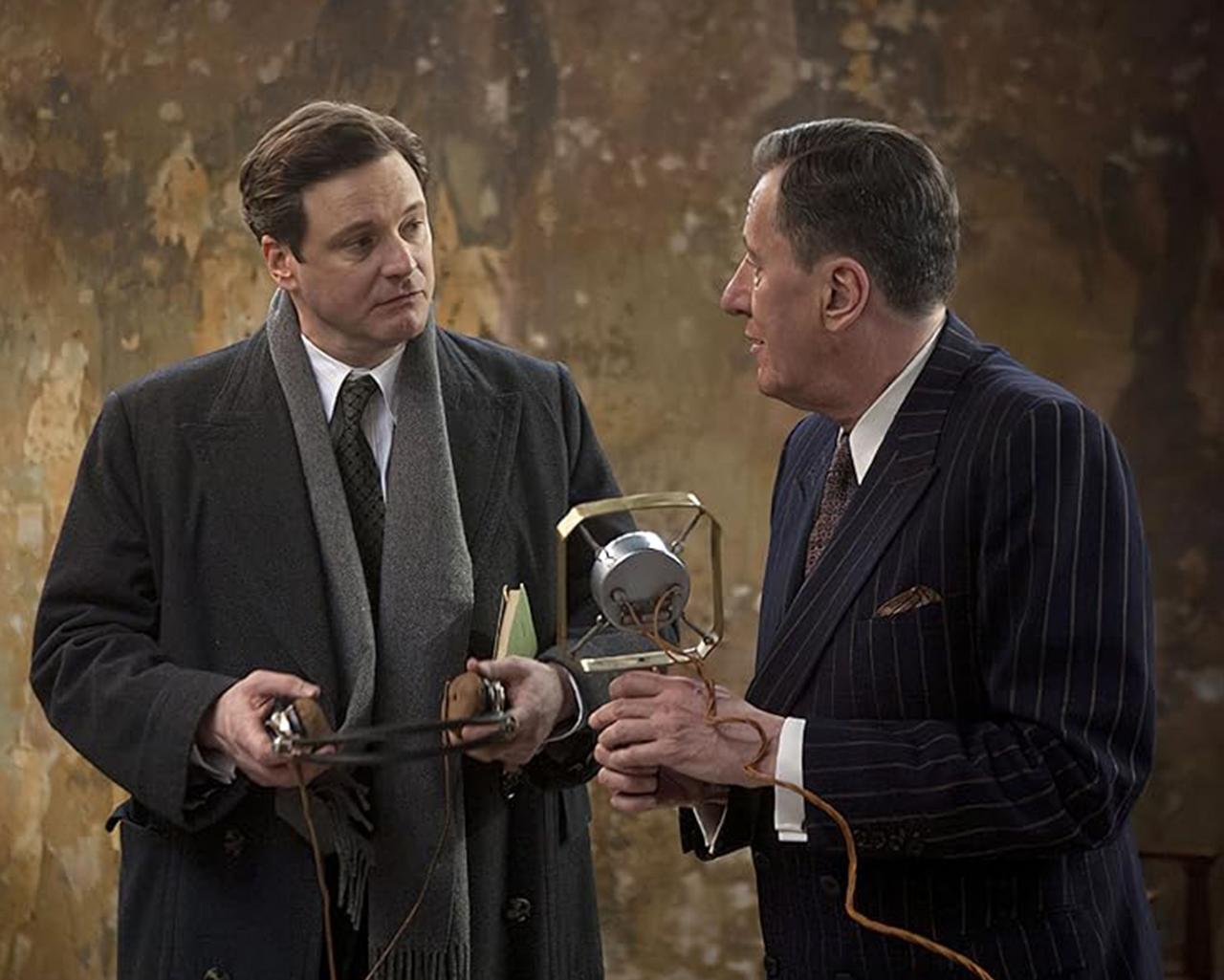 A scene from the 2010 film The King’s Speech showing a man practicing a speech with his coach
