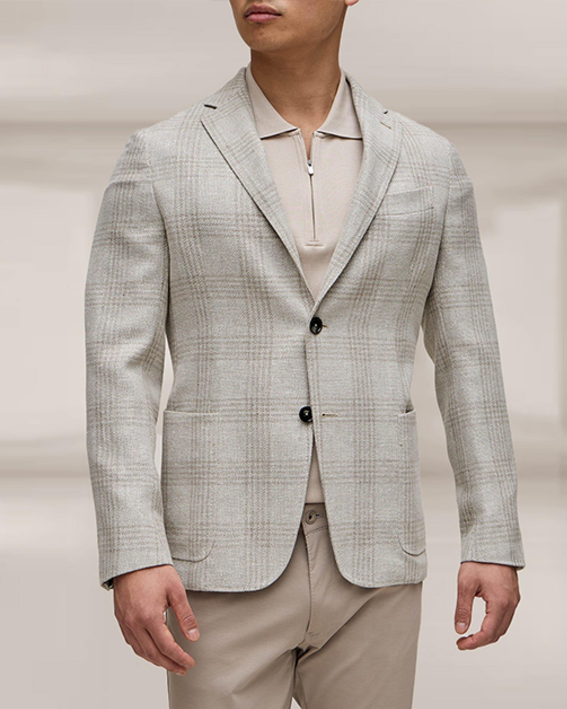 Male model wearing a beige ZEGNA sport jacket