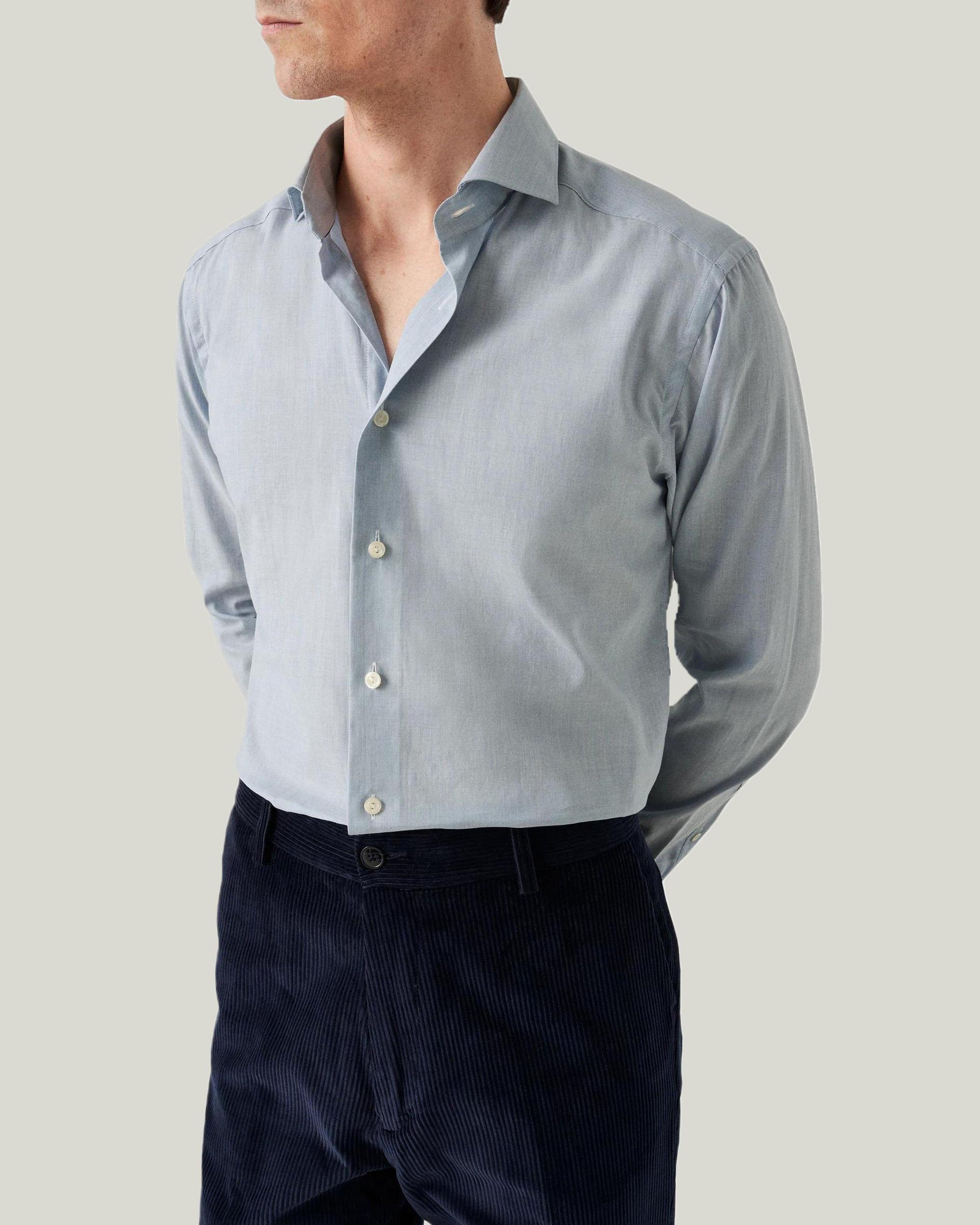 Male model wearing a grey wrinkle free Eton shirt
