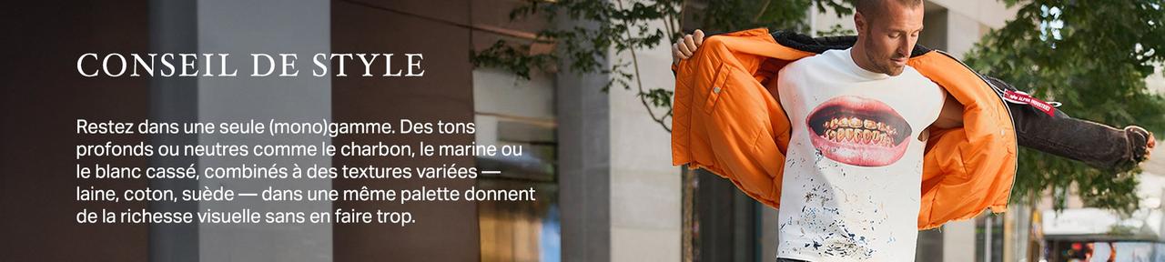 Homme portant une veste orange superposée à un t-shirt à motif
