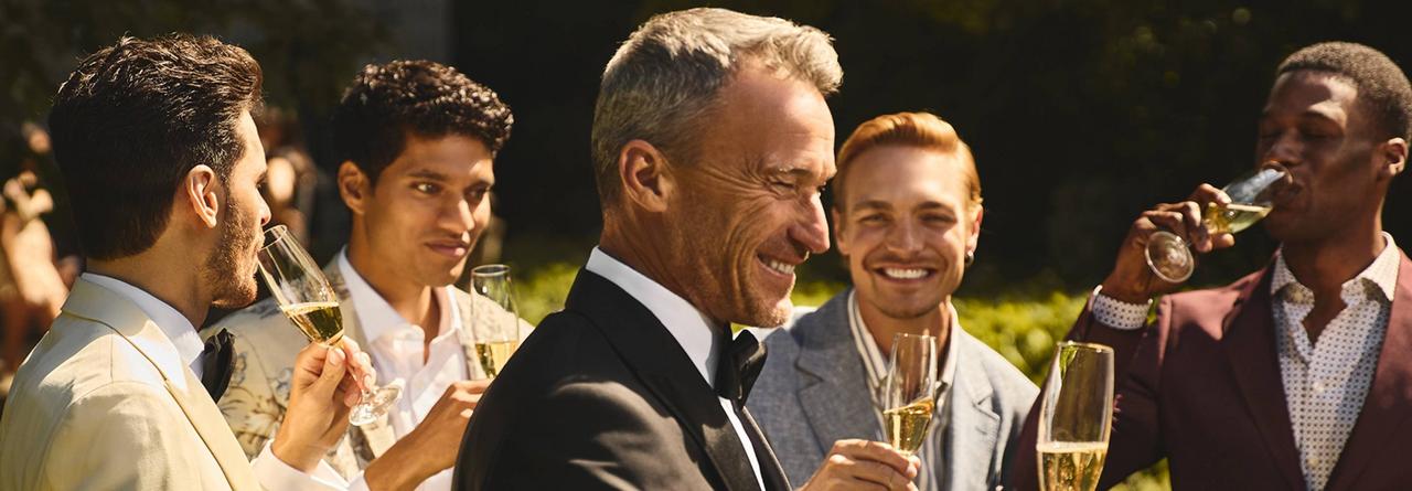 Wedding guest cheering on the grooming during a speech