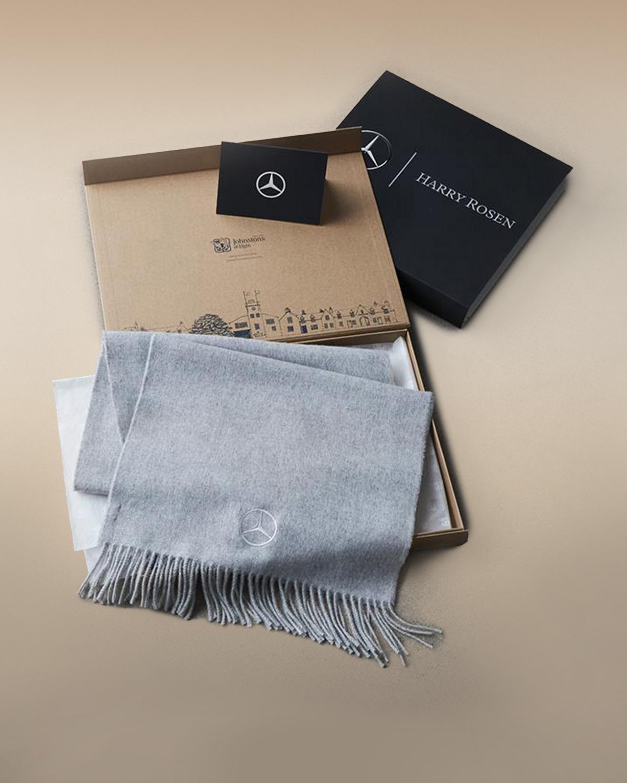 Box with a grey scarf inside signifying corporate services