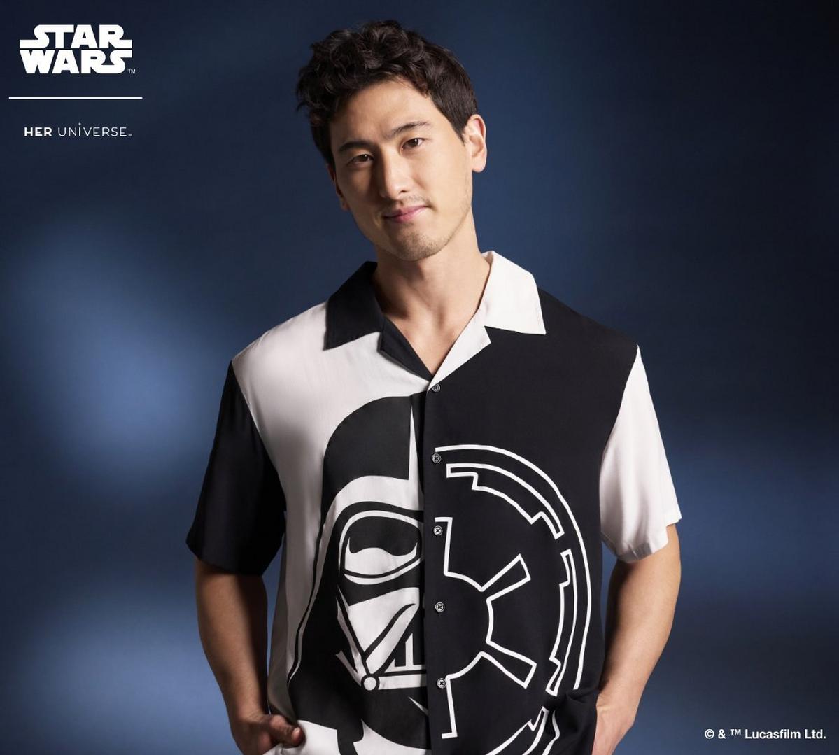 Man wearing black and white star wars button down shirt