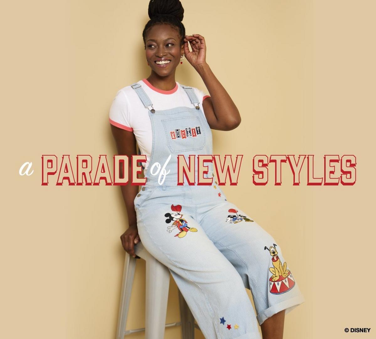 Woman wearing disney denim overalls