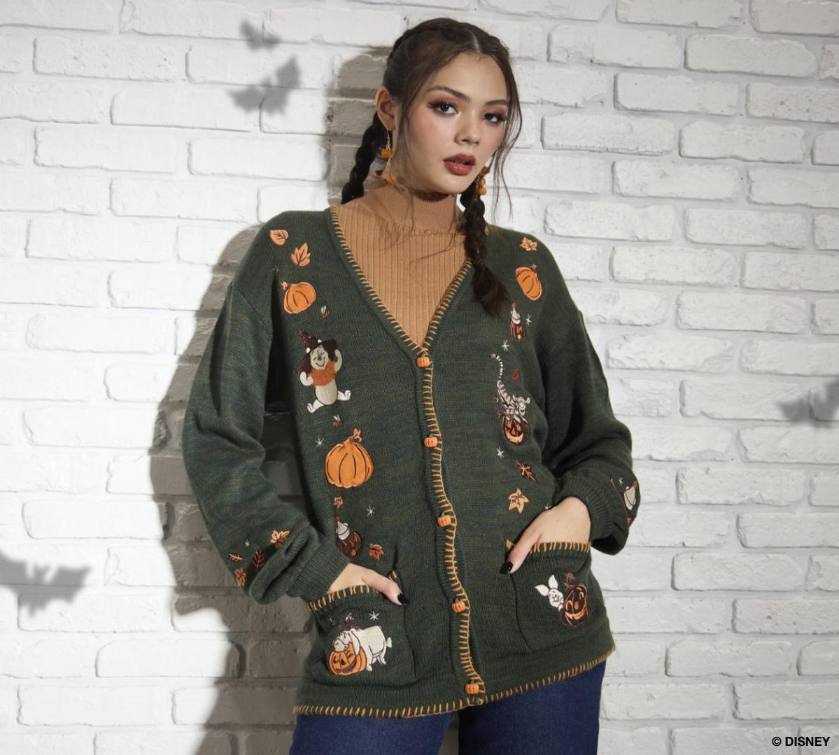 Woman wearing a green Winnie the Pooh cardigan