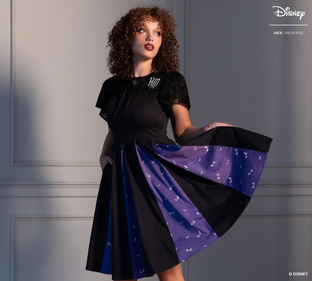 Woman wearing a black and purple dress