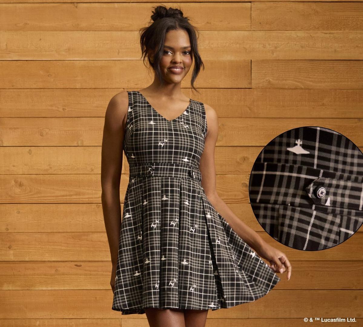 Woman wearing a grey dress. Shop dresses