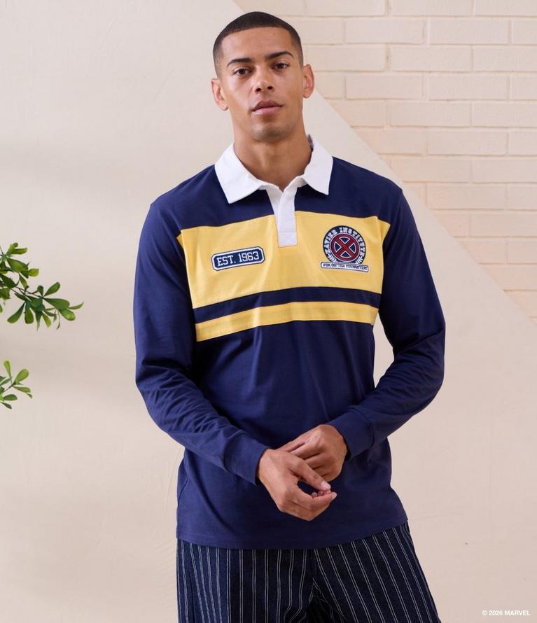 Model wearing a navy and yellow rugby shirt with Marvel X-Men patches and white collar.