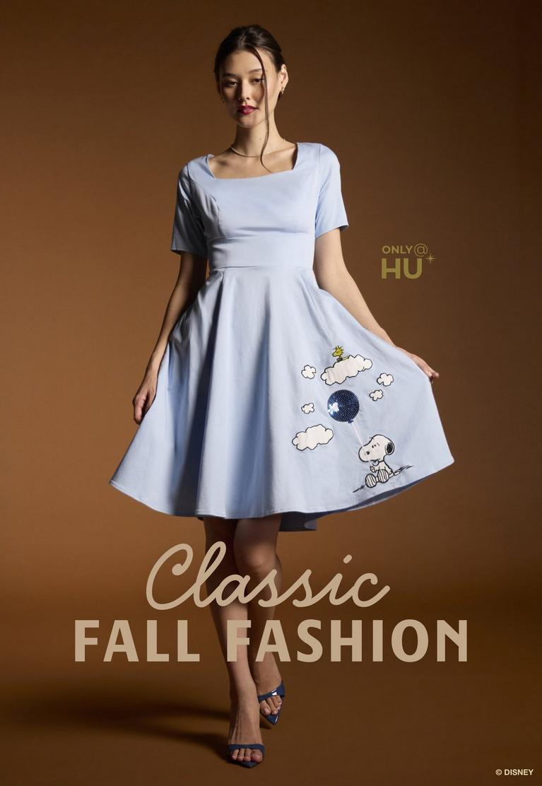 Model wearing light blue fit-and-flare dress with Snoopy balloon graphic and “ONLY@HU” text. Shop now.