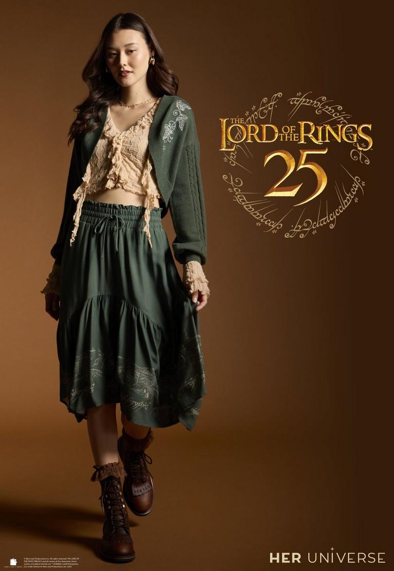 Model wearing green cardigan and skirt set with “The Lord of the Rings 25” and Her Universe logo. Shop now.