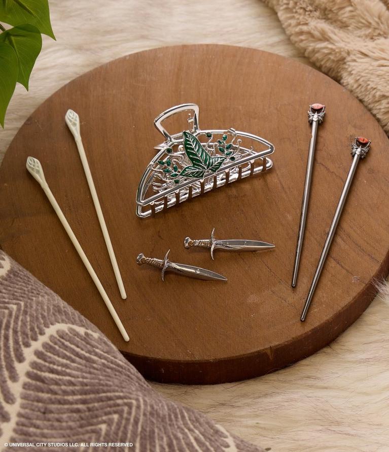 Metal leaf hair claw clip with two hair sticks and two dagger-shaped hair pins. Shop hair accessories.