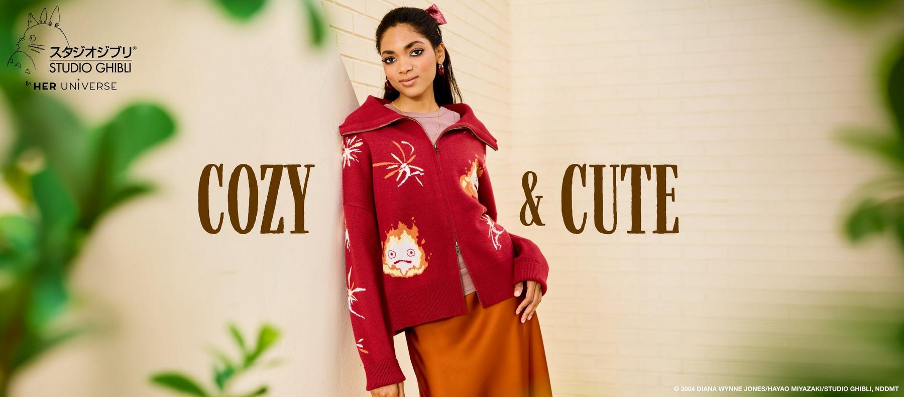 Model wearing Studio Ghibli by Her Universe red zip sweater with Calcifer graphic. Shop Studio Ghibli.