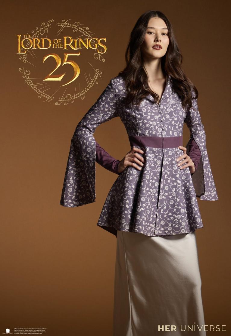 Model wearing a floral tunic with flared sleeves and sash belt, with “The Lord of the Rings 25”. Shop now.