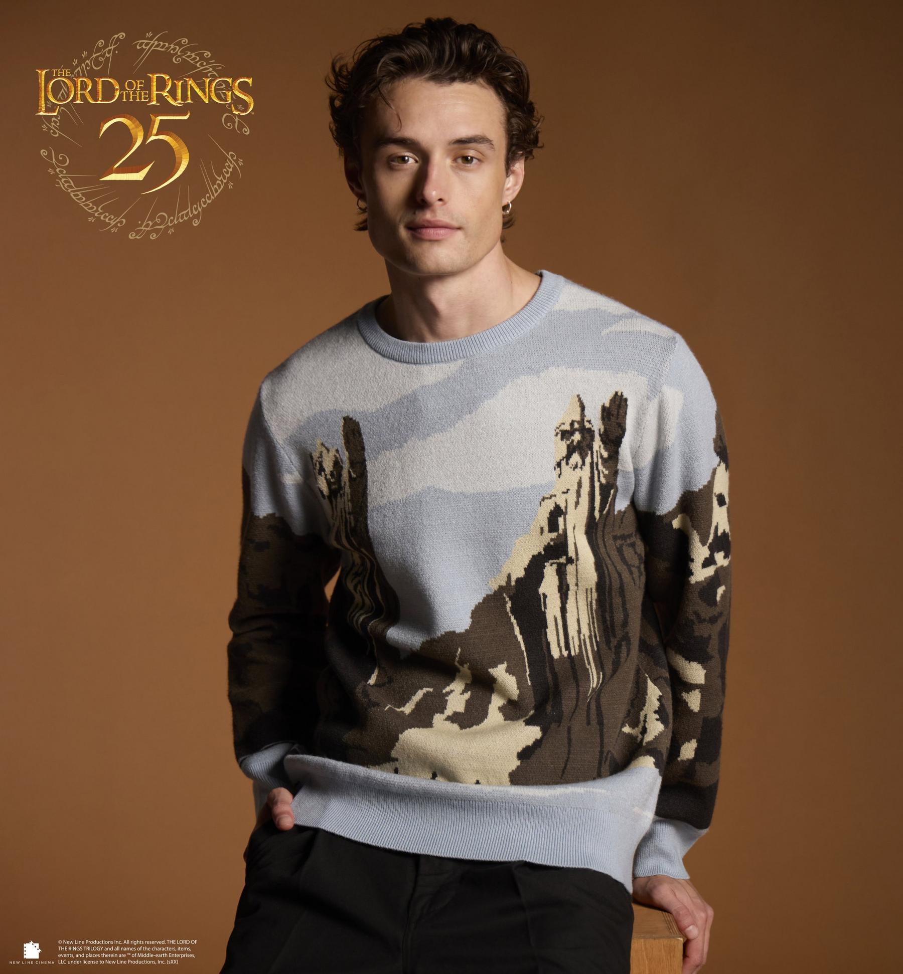 Model wearing The Lord of the Rings 25 sweater with landscape graphic. Shop The Lord of the Rings.